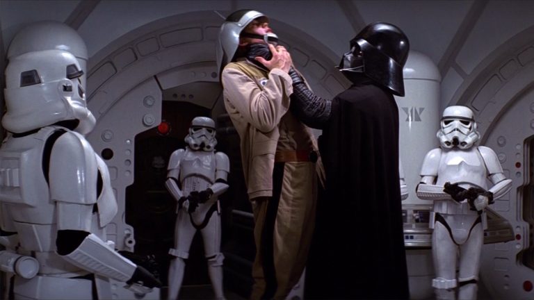 Darth Vader
choking a rebel soldier
as storm troopers watch
