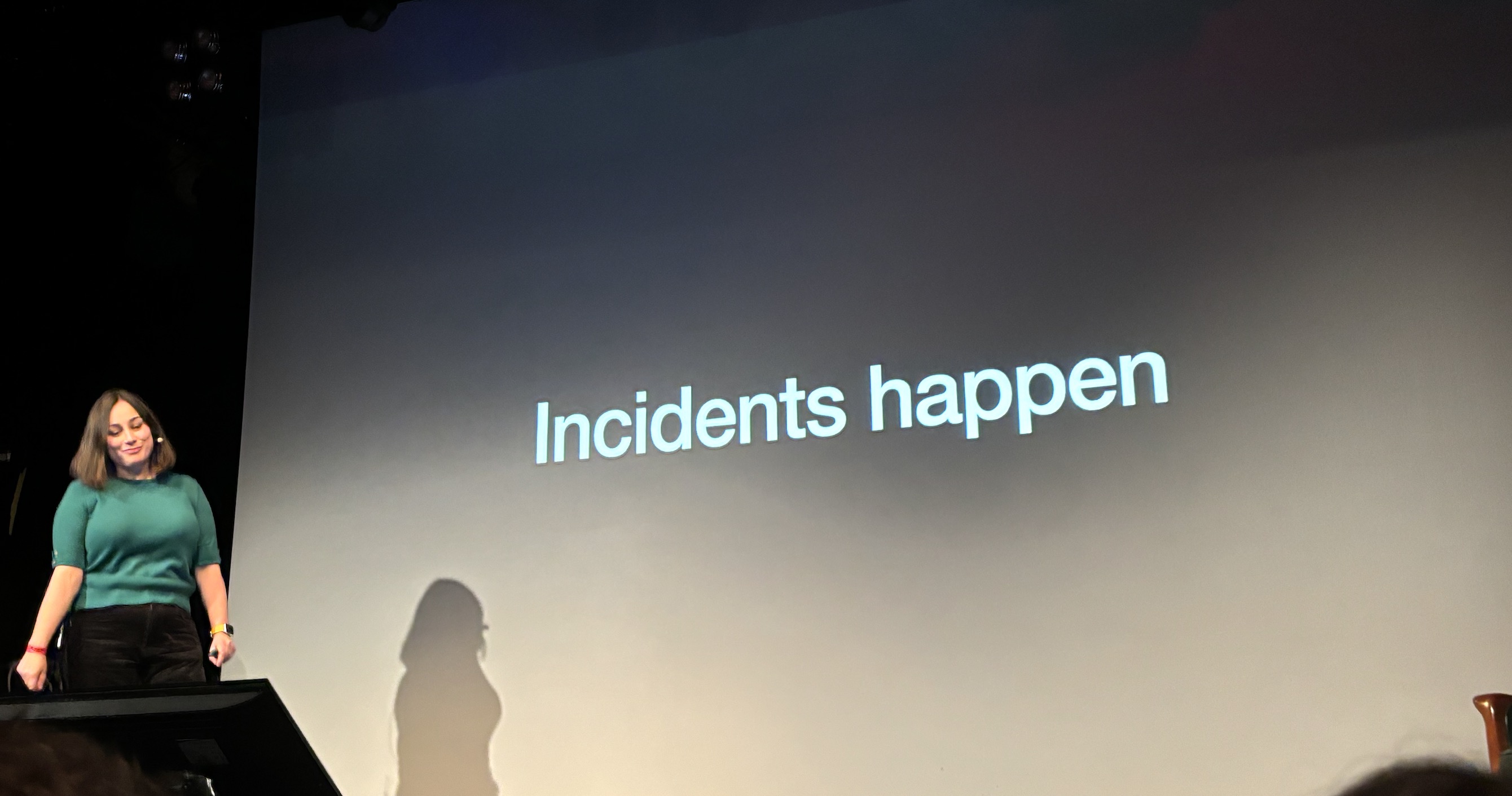 Sophie in front of a slide that says 'incidents happen'
