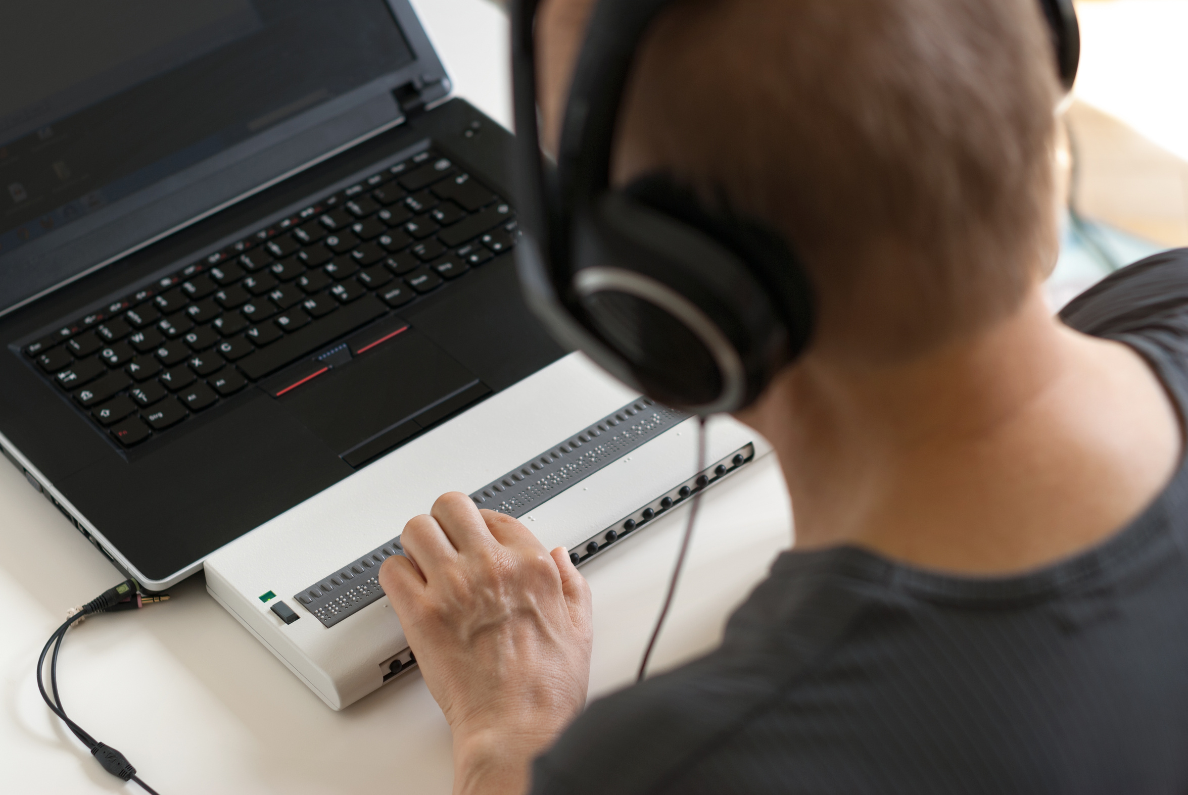 Braille computer attachment and headphones