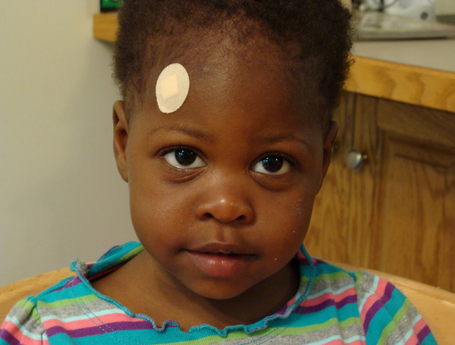 Girl with a 'skin color' bandaid significantly lighter than her skin